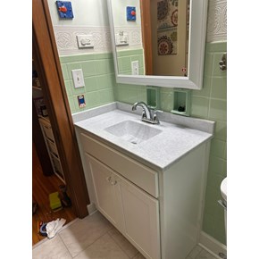 Ace Handyman Services handyman installed an Onyx Collection counter top with integrated sink and new vanity in Columbus, Ohio.