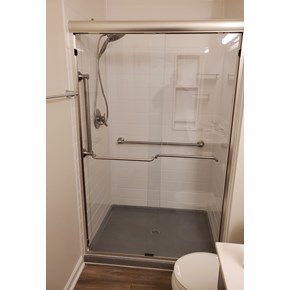 Ace Handyman Services remodeled bathroom in Lewis Center, Ohio with Onyx Collection Products subway tile looking shower surround, base, and accessories
