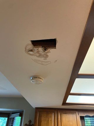 Before Ace Handyman Services handyman services repaired this kitchen ceiling in Columbus, Ohio
