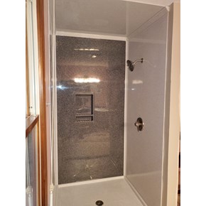 Ace Handyman Services installed an Onyx Collection base, wall surround, accessories, and fixtures in Baltimore, Ohio.