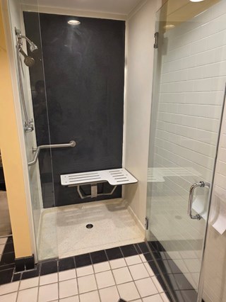 After Ace Handyman Services handyman remodeled this business's walk in shower using Onyx Collection shower surround panel in Columbus, Ohio