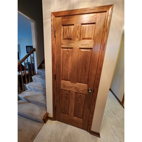 Ace Handyman Services stained and installed six panel doors and trim in Pickerington, Ohio.