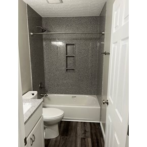 Bathroom Remodel in Canal Winchester using Onyx Collection shower surround and Shaw flooring