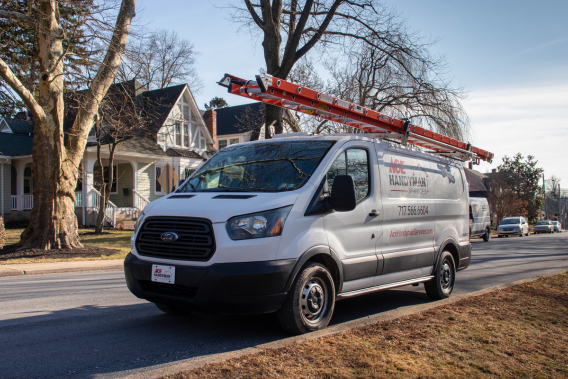 An Ace Handyman van in Camp Hill neighborhood outside beautiful houses. An Ace Handyman van in Camp Hill neighborhood outside beautiful houses.