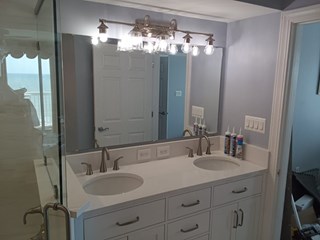 Bathroom vanity, faucets, light, outlets, and mirror install after in North Myrtle Beach, SC.