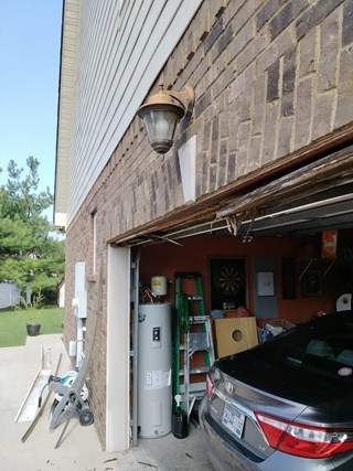Garage trim wood rot repair project before in Murfreesboro, TN