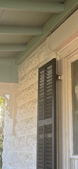 Repaired porch reattached to historic Fredericksburg, TX home after foundation damage.