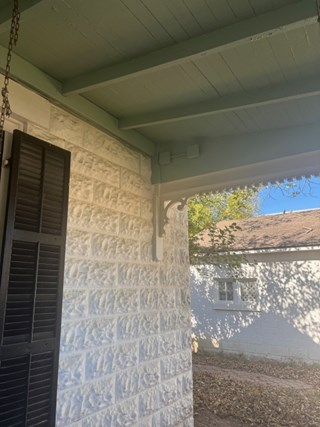 Repaired porch reattached to historic Fredericksburg, TX home after foundation damage.