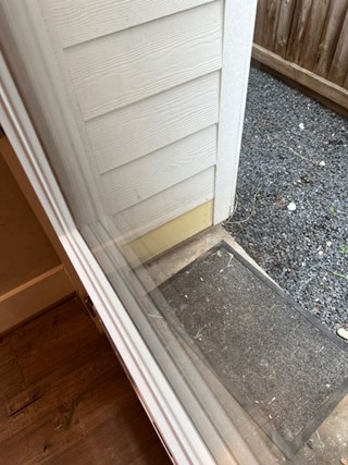 Repaired Exterior Siding by Back Door
