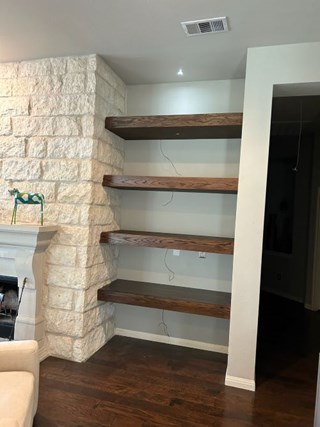 After custom built floating shelves in San Marcos, TX