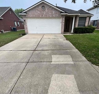 Driveway powerwash before in Austin Texas 