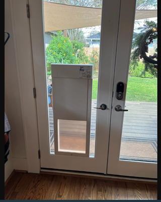 Completed install of dog door into glass
