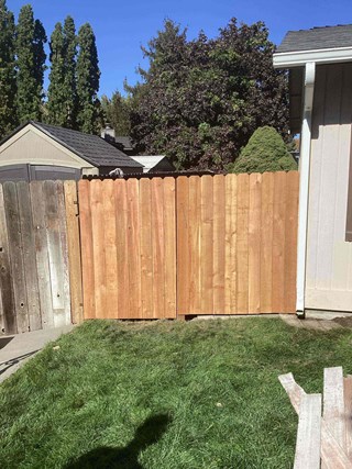 Close-up of fence post replacement in Richland, WA, expertly completed to stabilize a leaning fence.