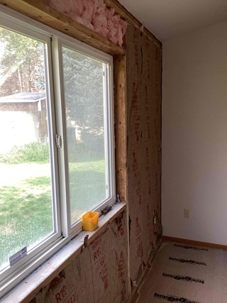 Team from Ace Handyman Services installing high-quality insulation in a West Richland, WA, home for better temperature control and lower utility bills.