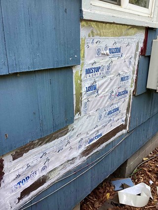 Damaged wood siding in Benton City, WA, repaired to like-new condition by Ace Handyman Services, ensuring structural integrity and improved aesthetics.