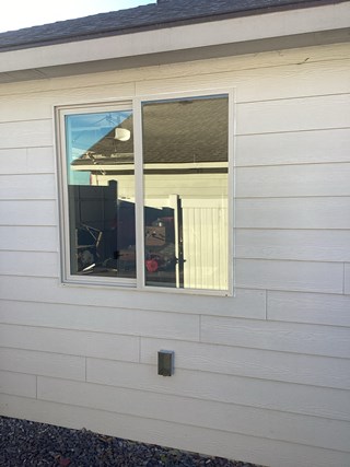 Before and after photo of a new energy-efficient window installation by Ace Handyman Services in Kennewick, WA, enhancing natural light and insulation.