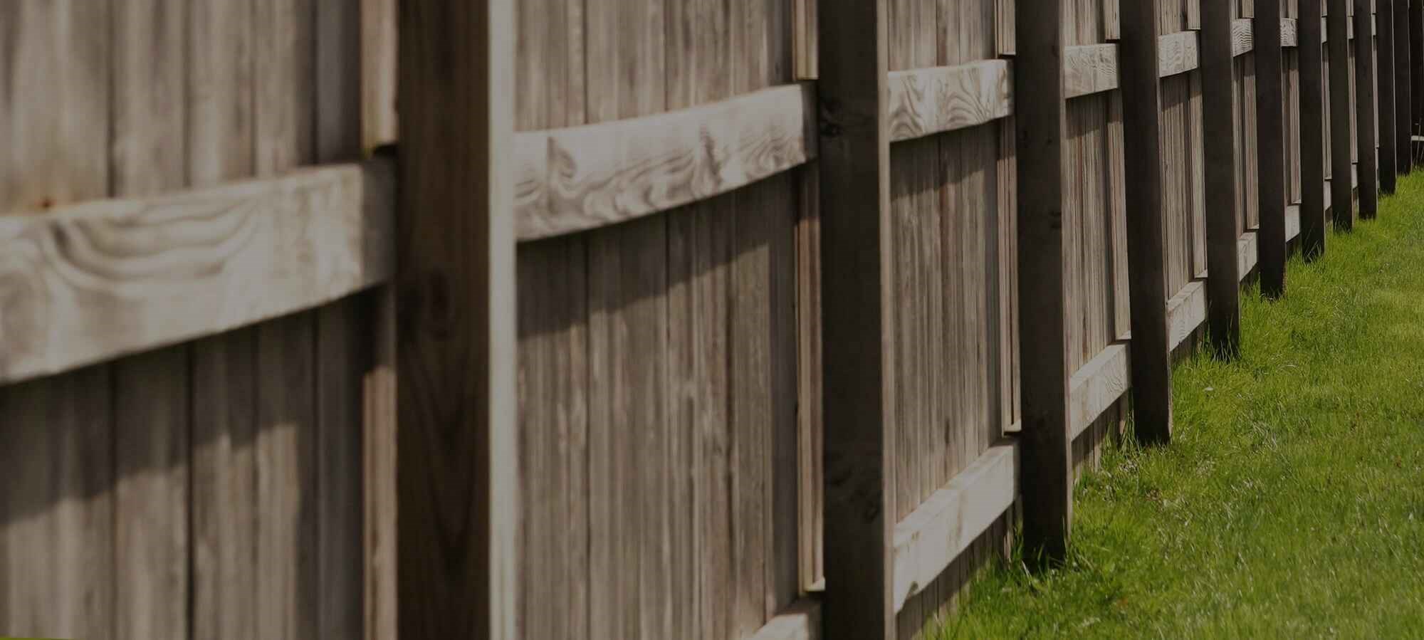 Handyman repairing and maintaining a wood deck and fence in Pasco, WA backyard Handyman repairing and maintaining a wood deck and fence in Pasco, WA backyard