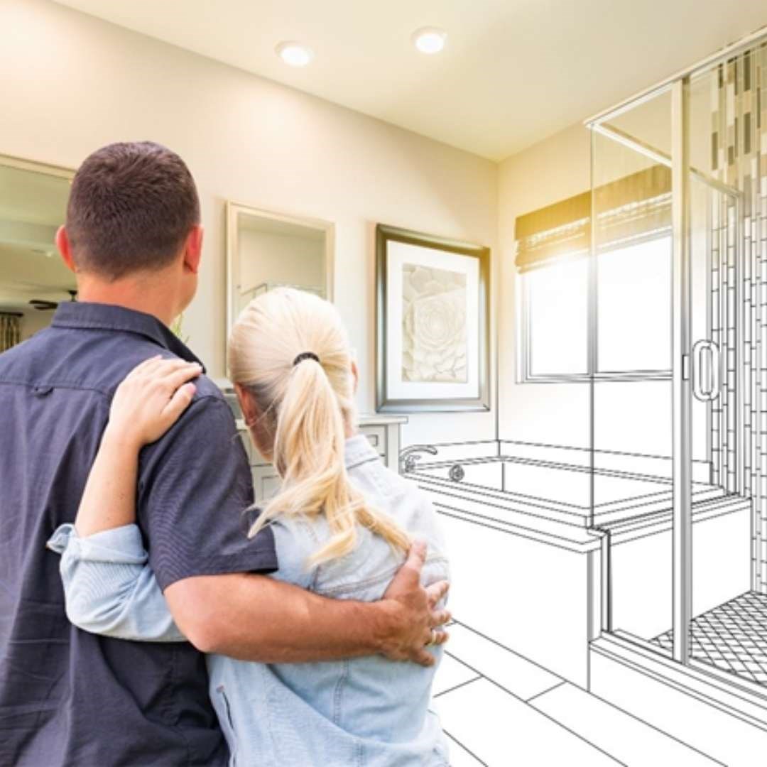 A couple standing with their arms around each other while looking at a half realistic half illustrated bathroom.