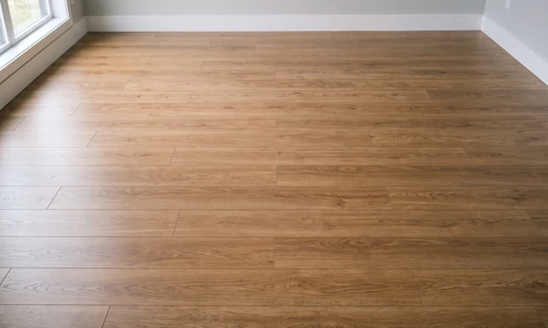 Finished laminate floor with visible plank seams, consistent color, and an even satin sheen