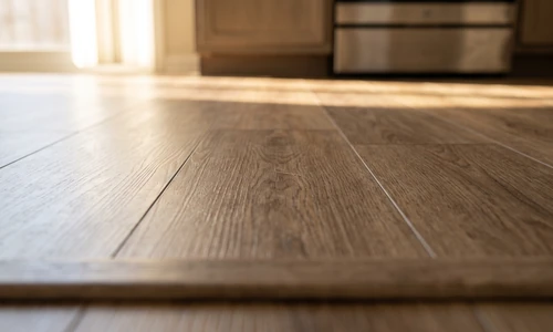 Finished vinyl floor section after scratch repair, the repaired area blending seamlessly under natural light