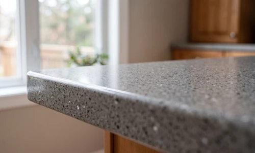 Finished quartz countertop repair blended nearly invisibly into the surrounding surface