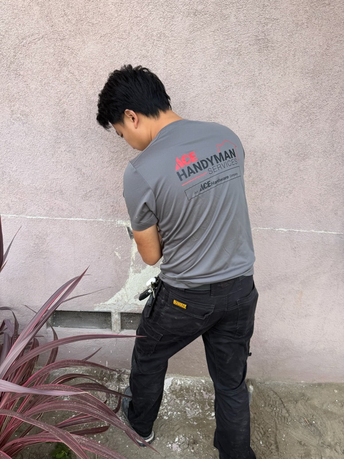 https://acehandyman-dss.ingeniuxondemand.com/Images/Offices/California/Coastal Orange County/Images/Ace Handyman Services craftsman repairing a worn section of exterior stucco on a home..jpeg Ace Handyman Services craftsman repairing a worn stucco patch near the foundation of a Newport Beach home