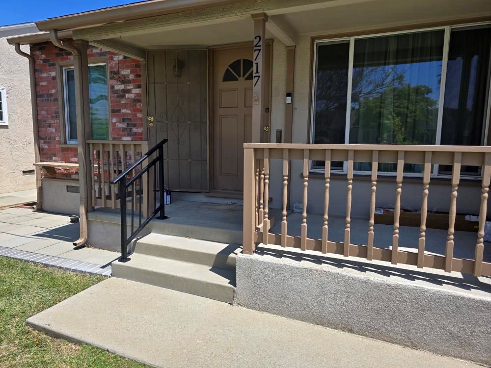 https://acehandyman-dss.ingeniuxondemand.com/Images/Offices/California/Long Beach/Team Images/Project images/Front porch repair and repaint with new handrail Lakewood..jpg Repainted front porch with refreshed railings and a new black metal handrail in Lakewood