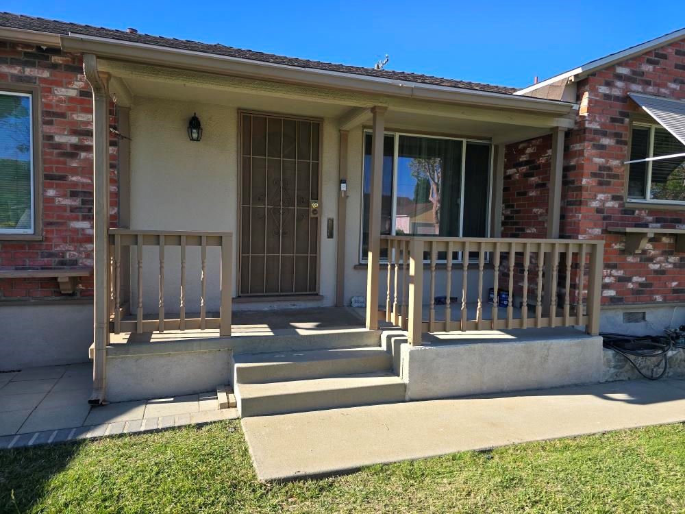 https://acehandyman-dss.ingeniuxondemand.com/Images/Offices/California/Long Beach/Team Images/Project images/Front porch repair and repaint with new handrail Lakewood.jpg Worn, faded front porch with old wood railings before repair in Lakewood