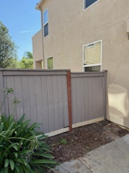 Exterior wood side gate relaced the supporting post, trim, and adjusted the latching mechanism