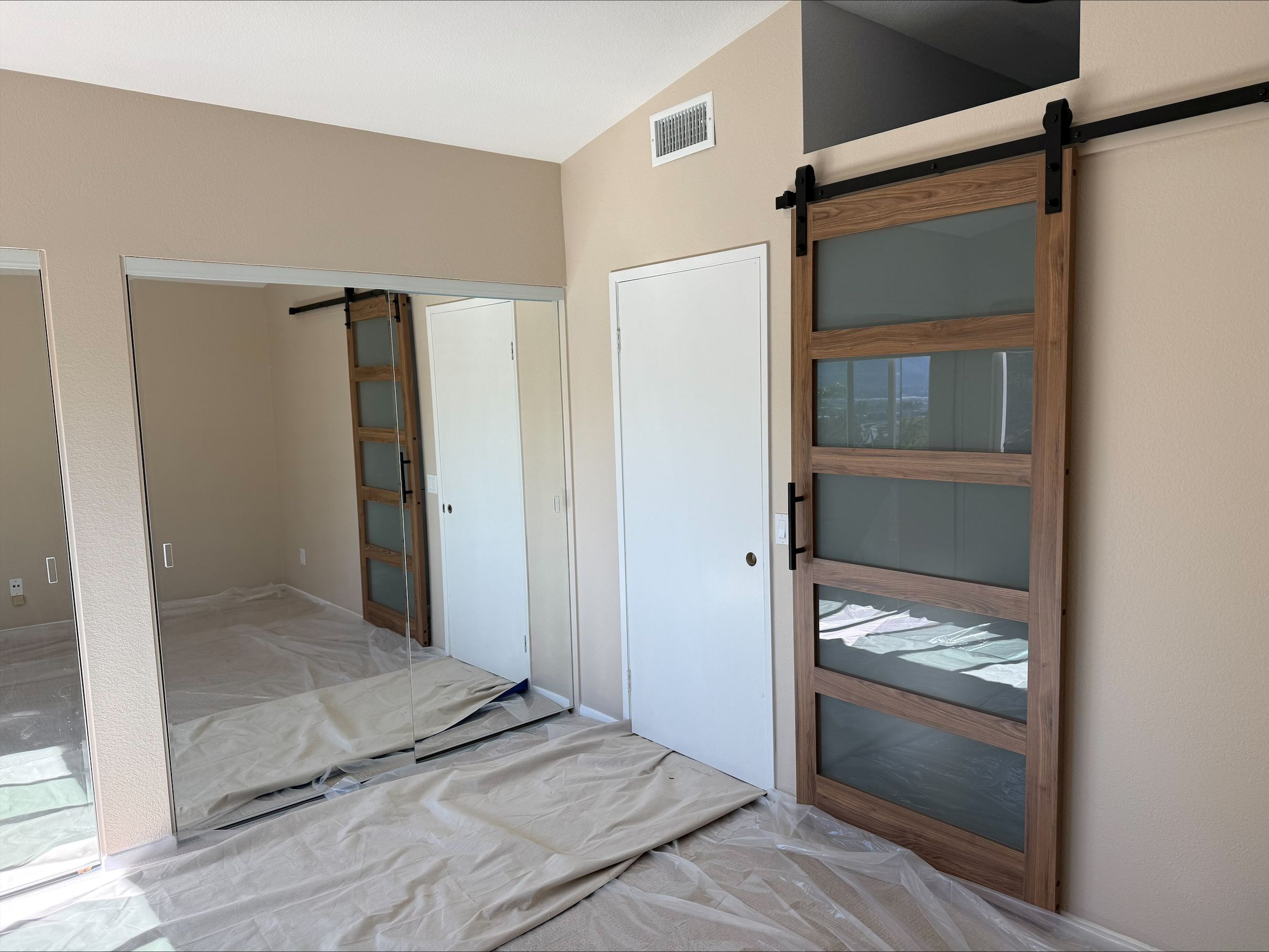 https://acehandyman-dss.ingeniuxondemand.com/Images/Offices/California/San Diego North County/Images/processed-0F178A75-262B-45C9-A46E-0F4ADD91BC2A.jpg Custom barn door installation in a San Diego bedroom by Ace Handyman Services