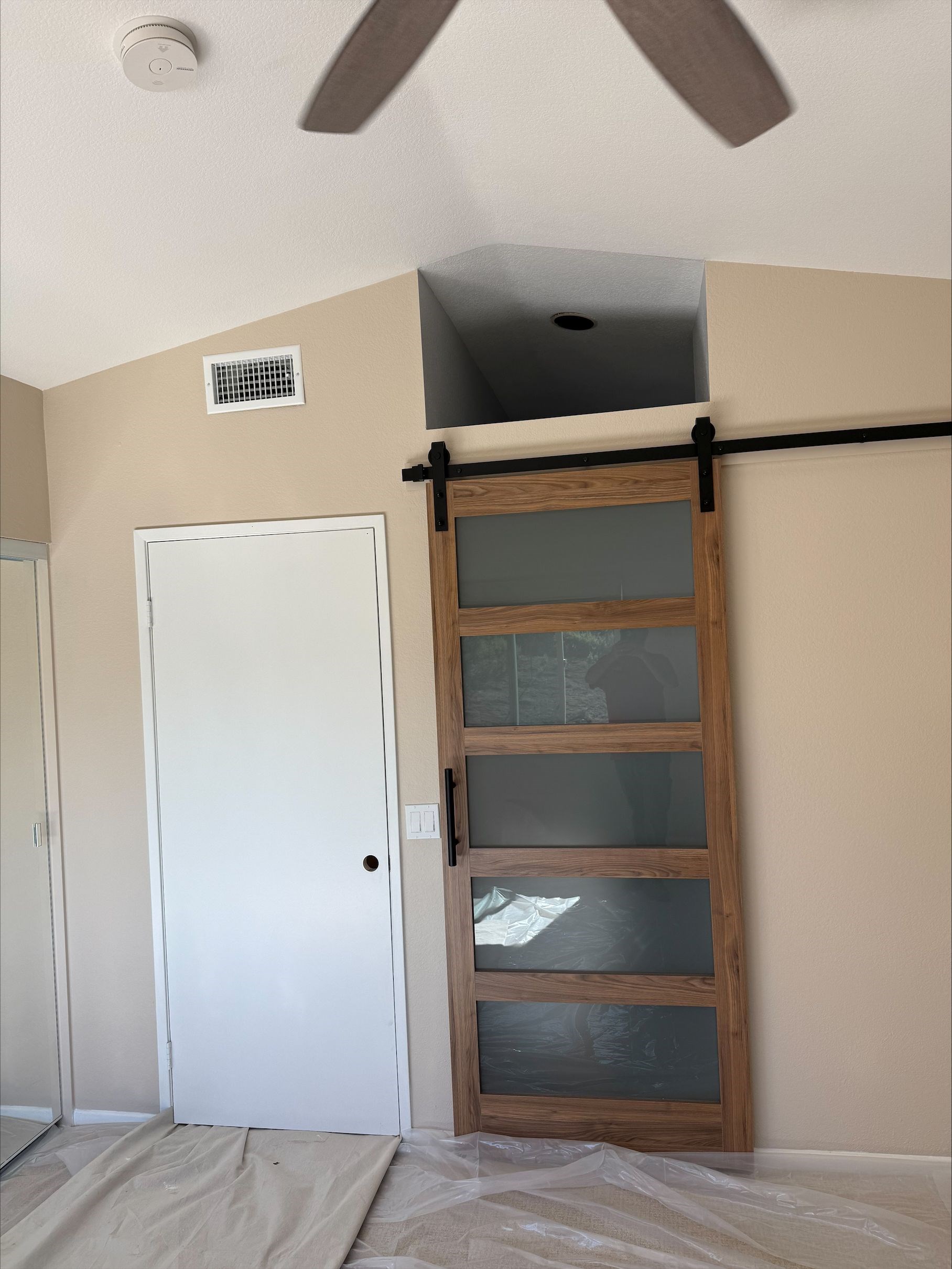 https://acehandyman-dss.ingeniuxondemand.com/Images/Offices/California/San Diego North County/Images/processed-52E776CA-9424-4D4A-B75A-DFDCEAA4C405.jpg Custom barn door installation in a San Diego bedroom by Ace Handyman Services