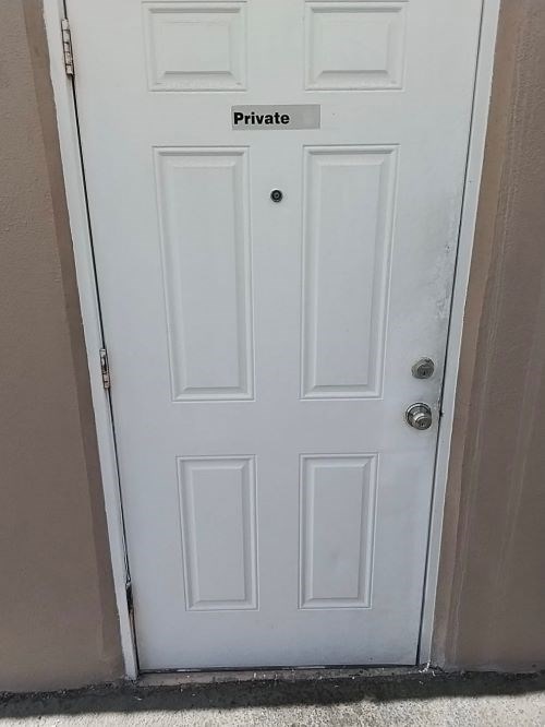White door labeled 