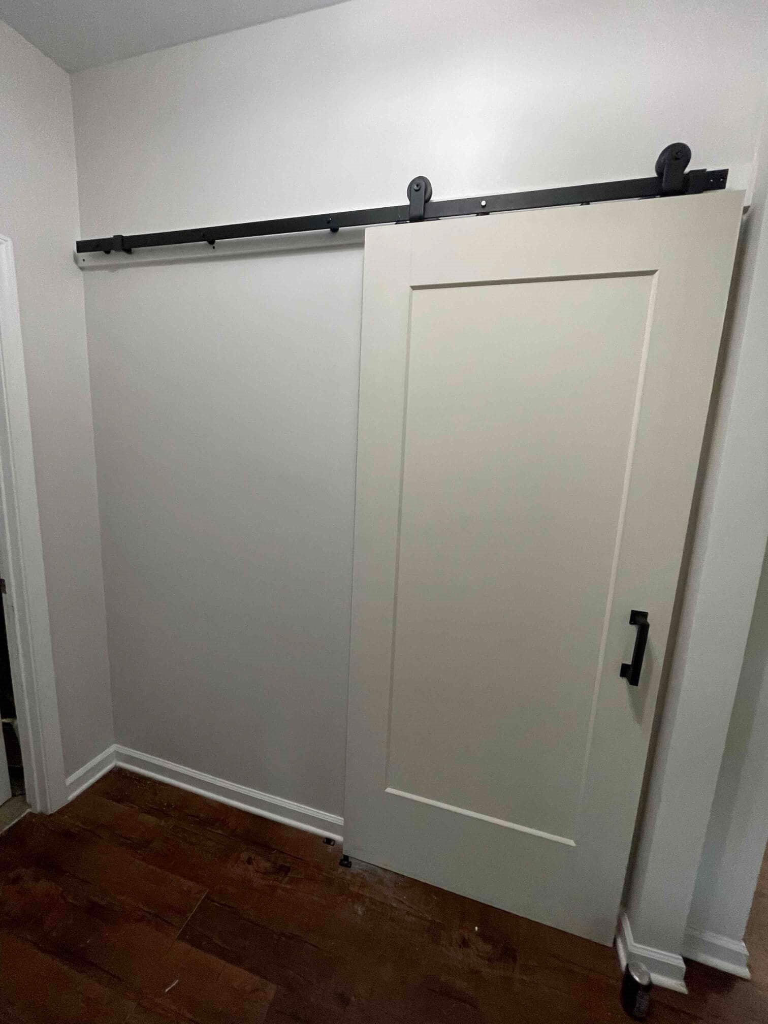 Sliding barn door installed on a wall.