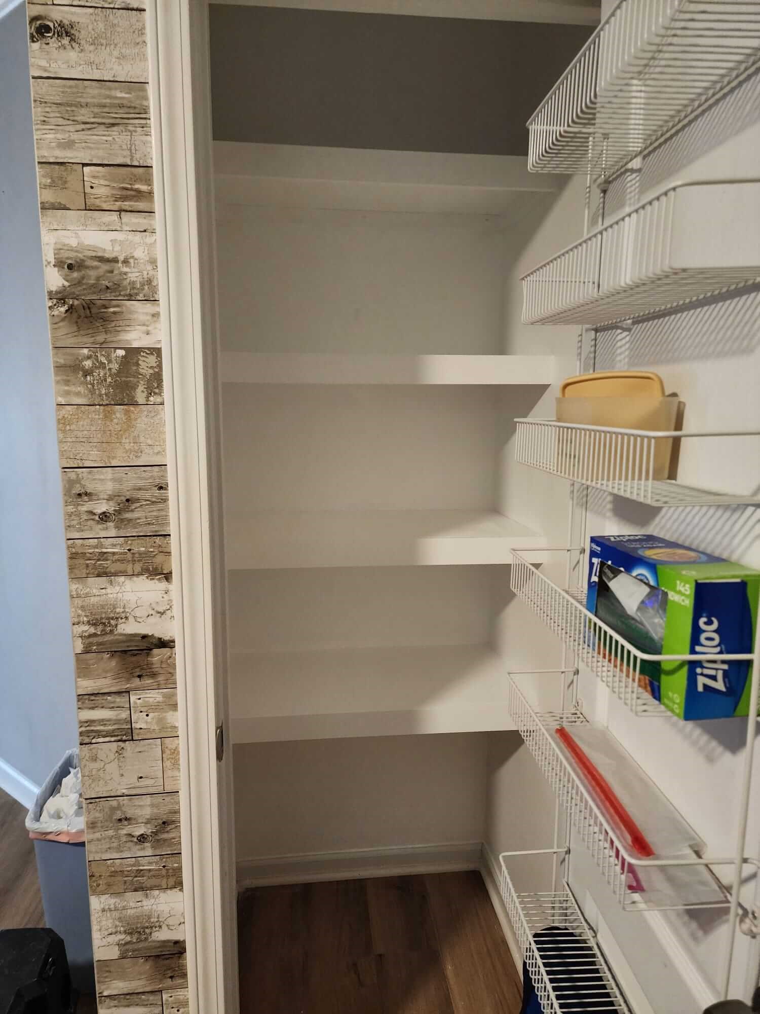 White pantry shelves with wire rack storage on the side.