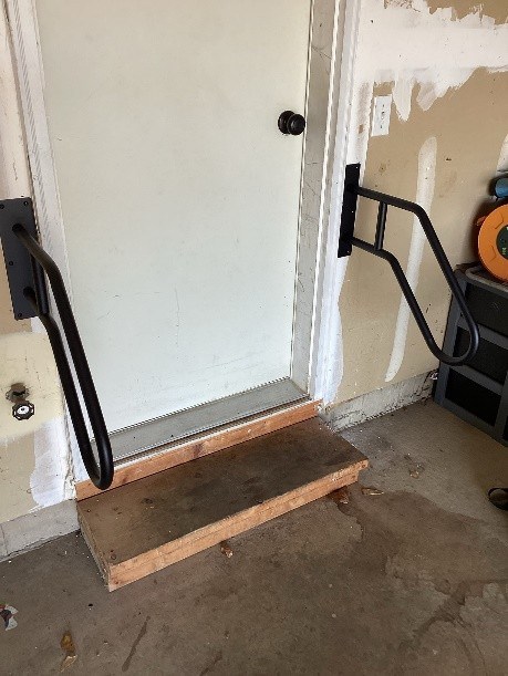 https://acehandyman-dss.ingeniuxondemand.com/Images/Offices/Illinois/Fox Valley/Blog/Something Secure railing 2.jpg wall mounted railing garage entrance