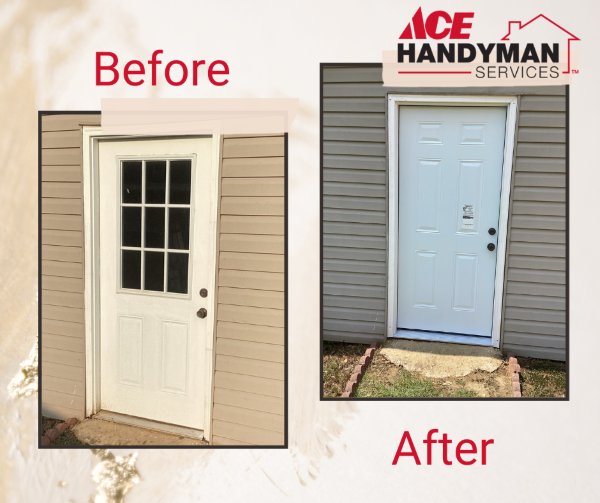 Old white door with window panels against beige siding.