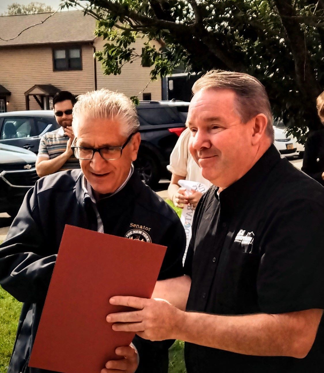 https://acehandyman-dss.ingeniuxondemand.com/Images/Offices/New York/Capital District Saratoga Region/Before and After Images/Owen, the owner, and Sen. Jim Tedisco.jpg Senator Tedisco and Owen Peterson holding the Proclamation welcoming AHS to the area