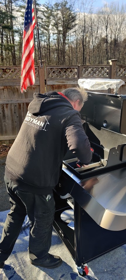 https://acehandyman-dss.ingeniuxondemand.com/Images/Offices/New York/Capital District Saratoga Region/Gallery Images/Grill 4.jpg AHS owner Owen assembling a Weber Genesis grill.