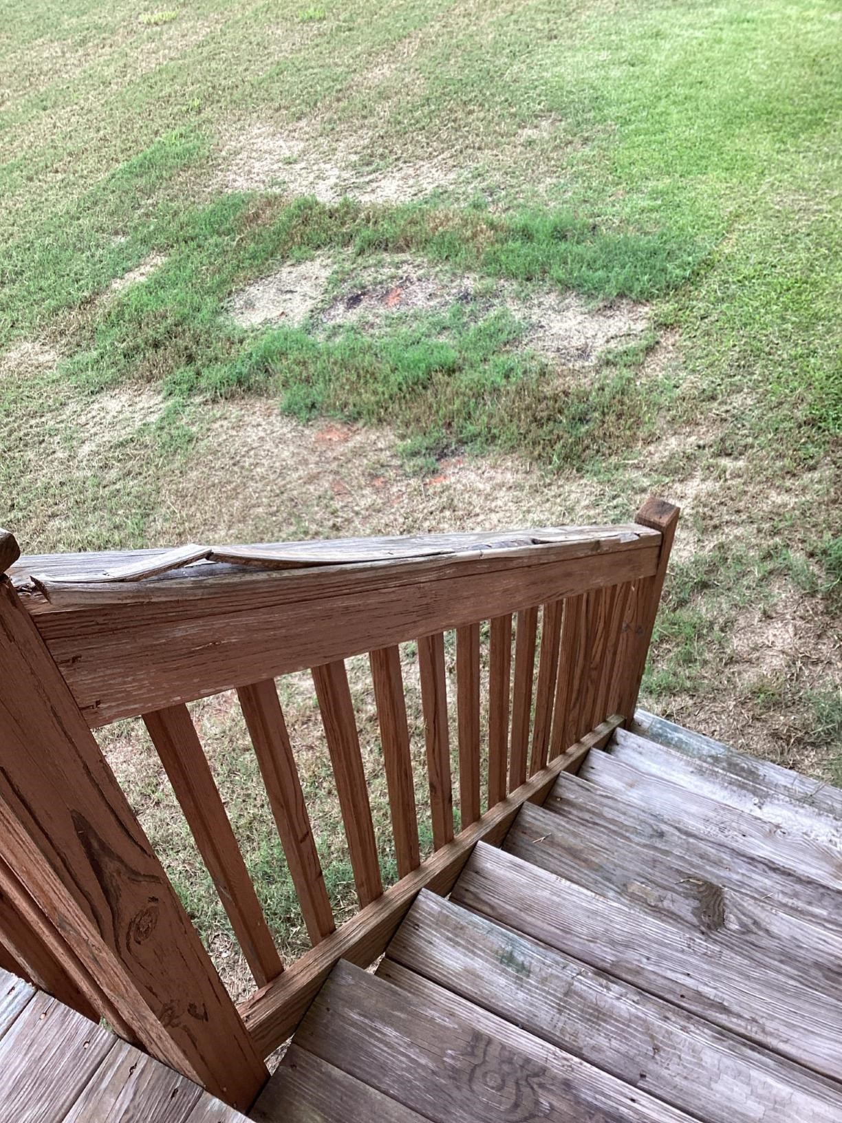 Rotted top board of a railing in Clayton NC