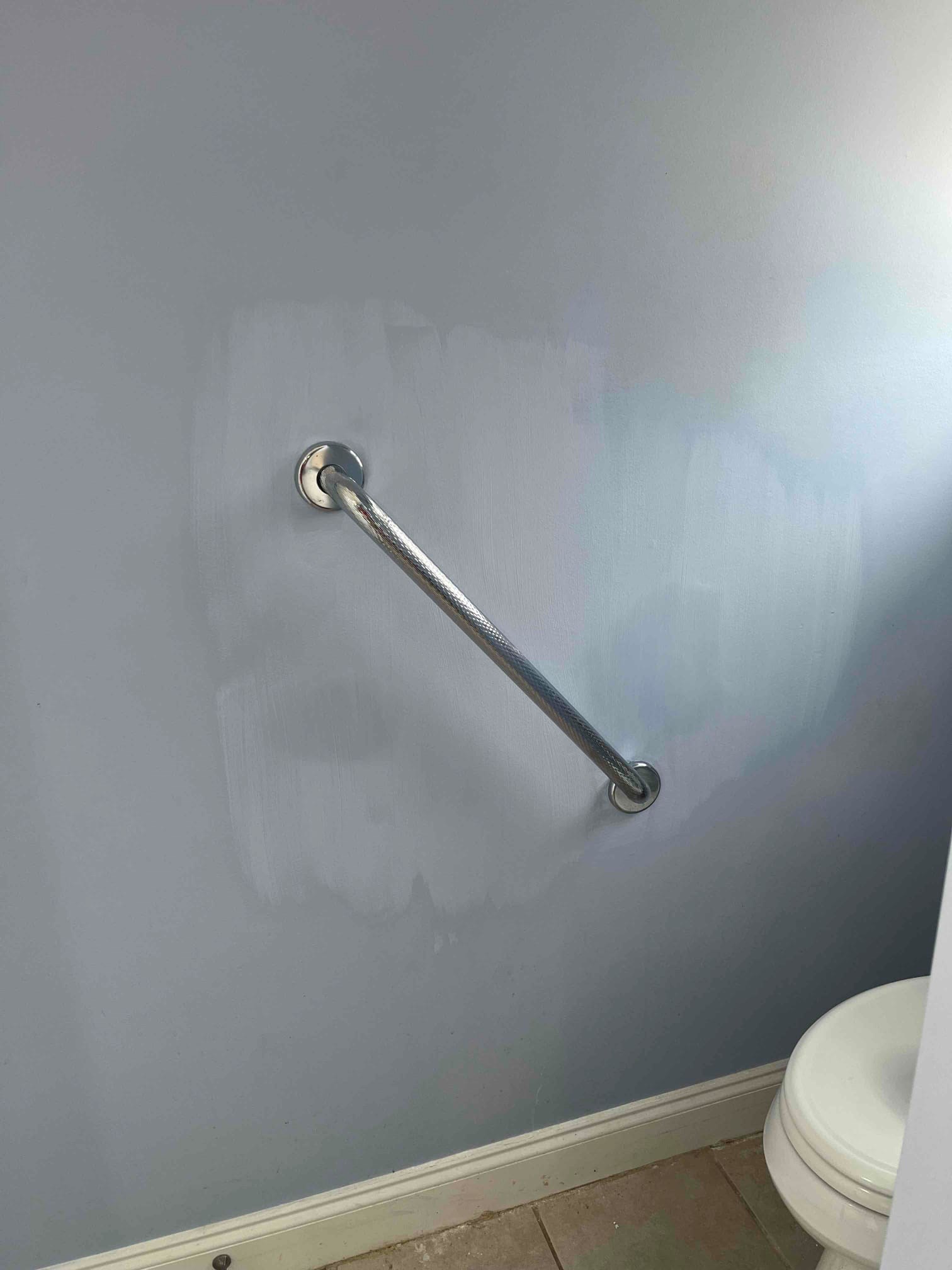 Clayton NC grab bar installed into drywall near a toilet