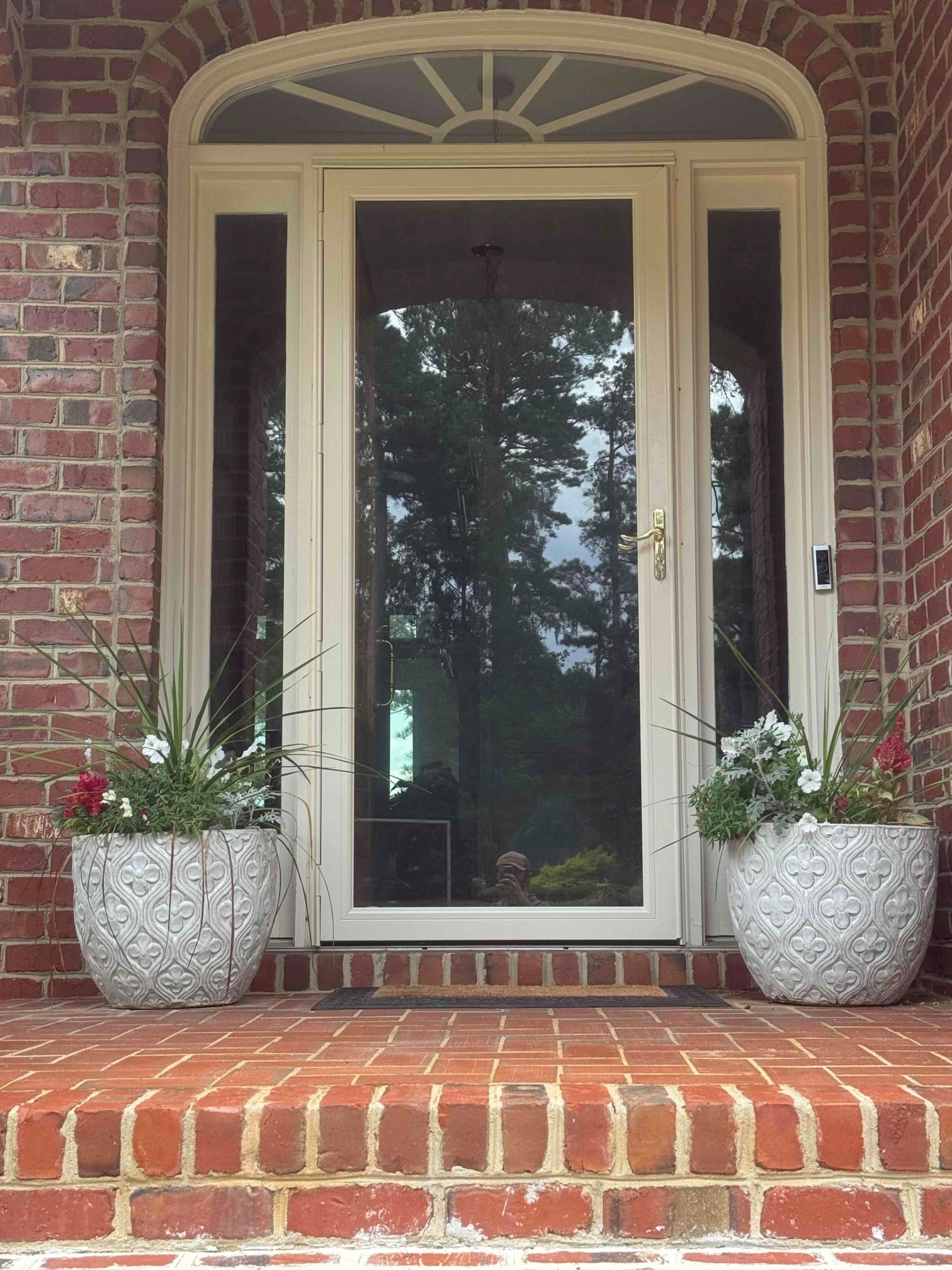 https://acehandyman-dss.ingeniuxondemand.com/Images/Offices/North Carolina/Clayton/35691926-ace-handyman-services-clayton-garner-nc-27529-storm-door-installation.jpg Full-view glass storm door installed on brick home in Garner, NC 27529