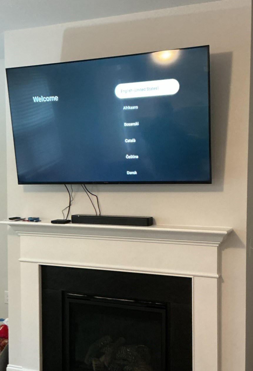 TV and soundbar installation above a gas fireplace in Clayton, NC