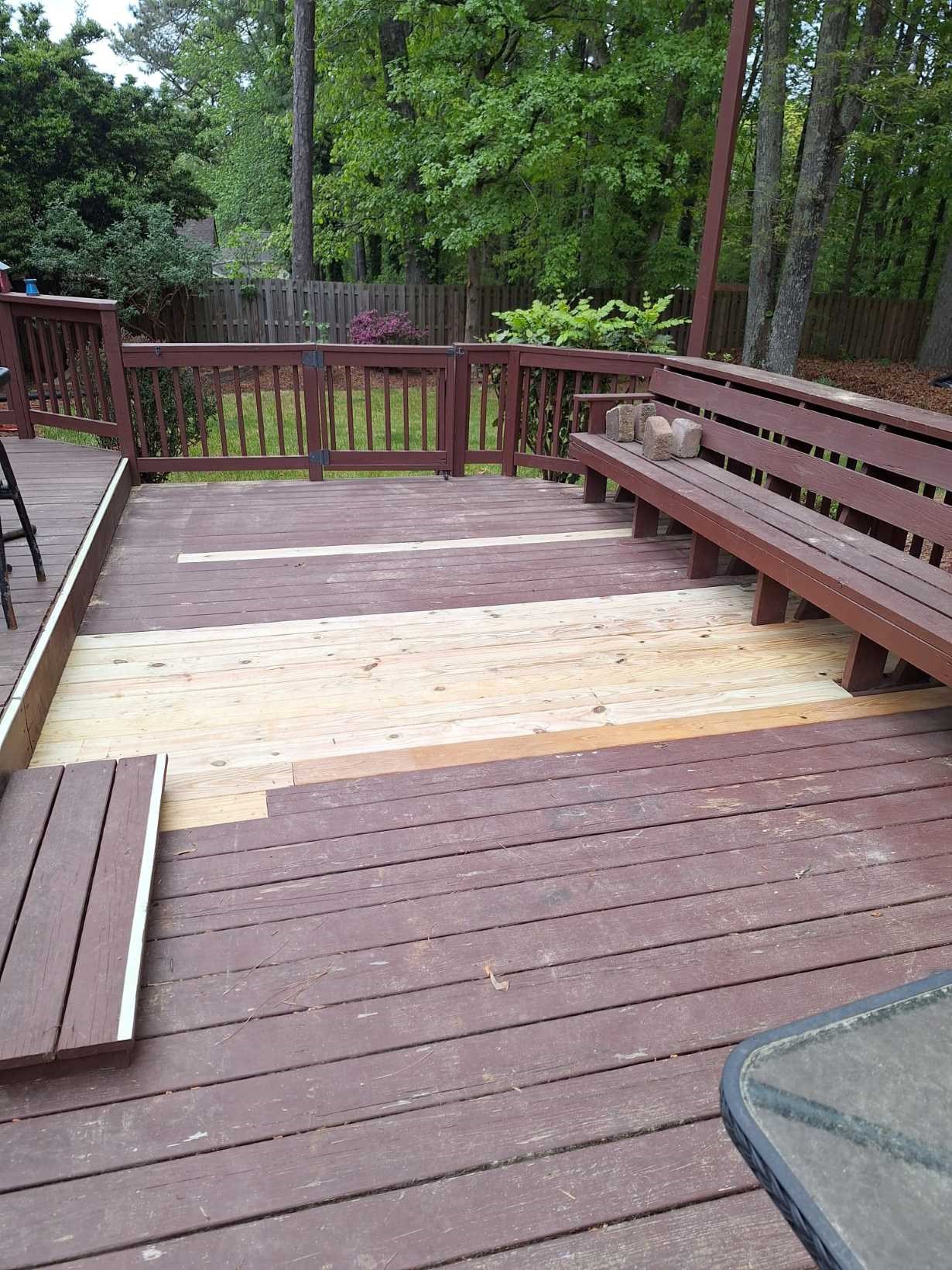 https://acehandyman-dss.ingeniuxondemand.com/Images/Offices/North Carolina/Durham Chapel Hill/17341928-selective-deck-board-replacement-on-stained-deck-north-durham-nc-ace-handyman-services.jpg Selective deck board replacement showing new pressure-treated boards alongside existing stained burgundy boards at a North Durham, NC home by Ace Handyman Services