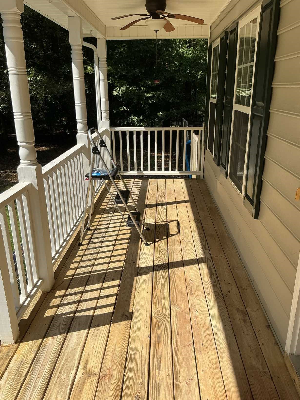 https://acehandyman-dss.ingeniuxondemand.com/Images/Offices/North Carolina/Durham Chapel Hill/32587820-deck-refinishing-bare-wood-before-south-durham-nc-ace-handyman-services.jpg Bare pressure-treated covered porch deck before staining at a South Durham, NC home by Ace Handyman Services