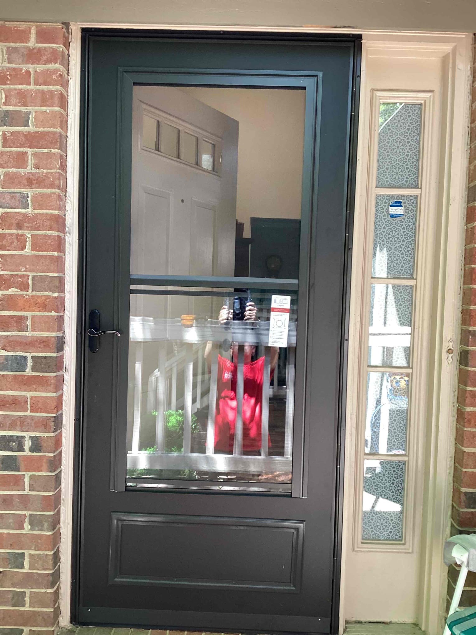https://acehandyman-dss.ingeniuxondemand.com/Images/Offices/North Carolina/Durham Chapel Hill/33323428-full-view-storm-door-install-brick-home-durham-27713-after.jpg