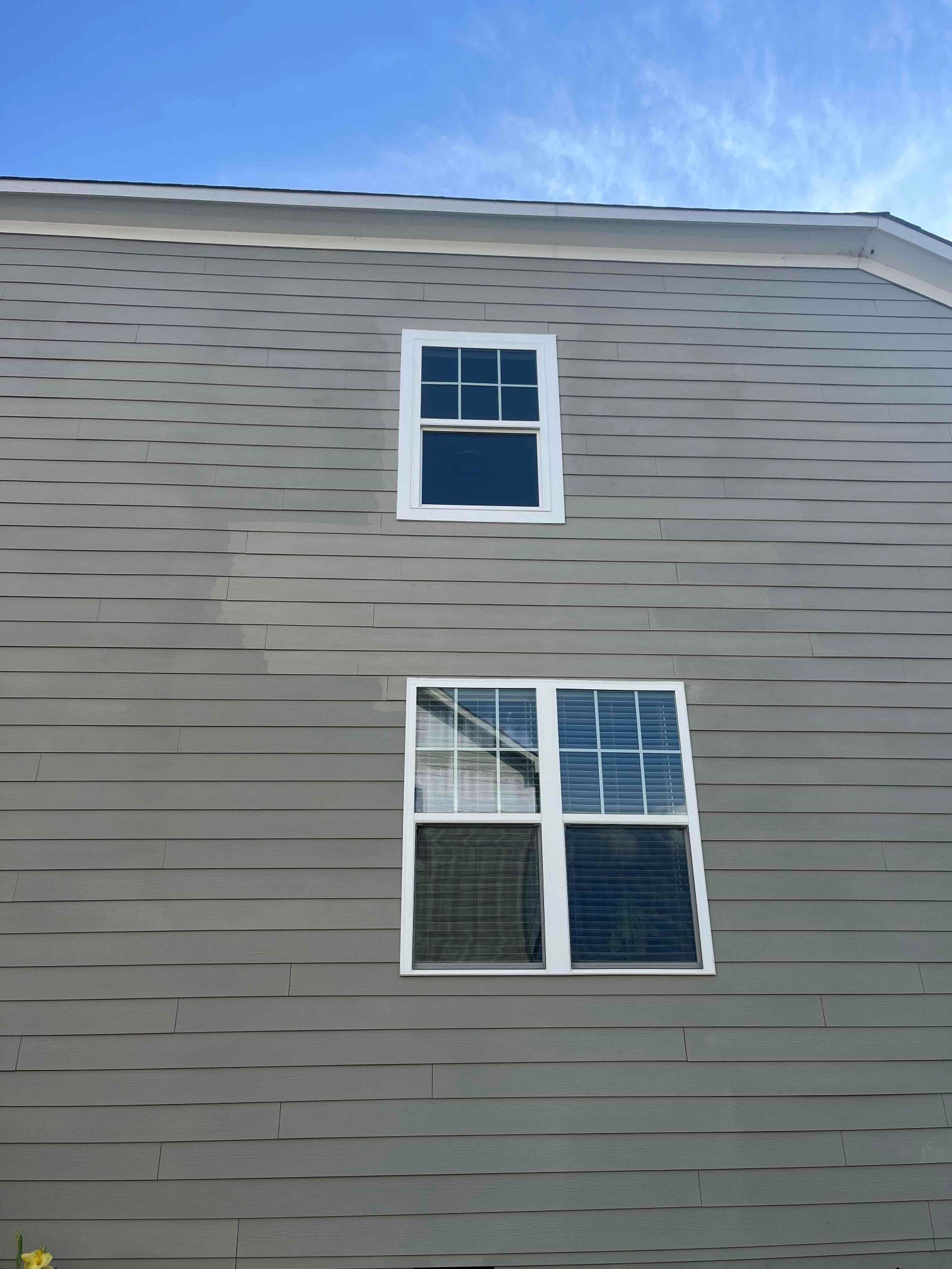 Completed window and exterior siding replacement with finished window area in Chapel Hill NC by Ace Handyman Services Durham Chapel Hill.