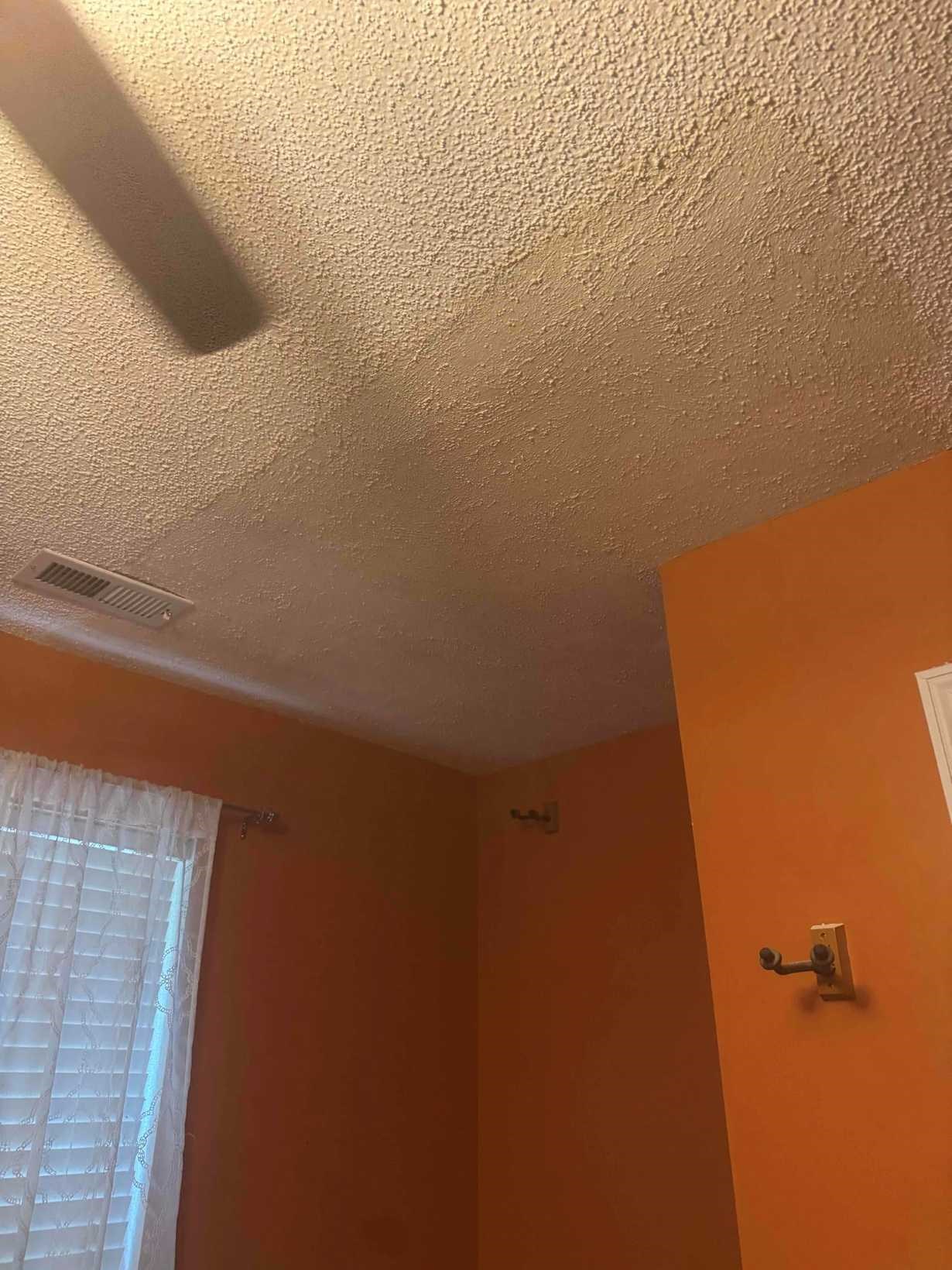 Fully restored popcorn ceiling with ceiling fan after water damage repair in a Southwest Durham, NC home by Ace Handyman Services