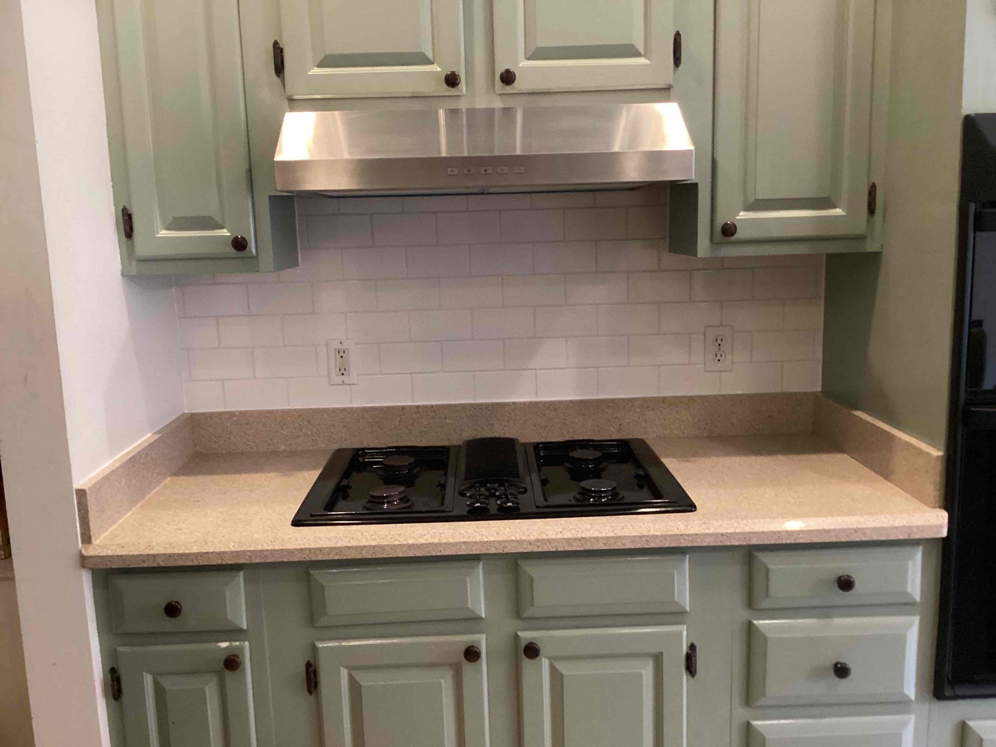 https://acehandyman-dss.ingeniuxondemand.com/Images/Offices/North Carolina/Durham Chapel Hill/36579480-Ace-Handyman-Services-Durham-Chapel-Hill-durham-nc-27707-kitchen-backsplash-install-stainless-range-hood-install-after.jpg Completed white tile backsplash and vent hood installation in Durham NC 27707