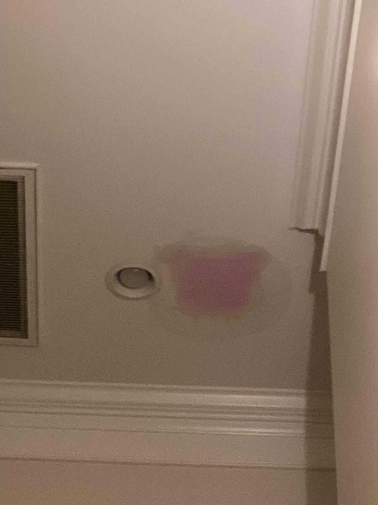 Drywall patch with primer applied on a hallway wall in a Chapel Hill, NC home by Ace Handyman Services