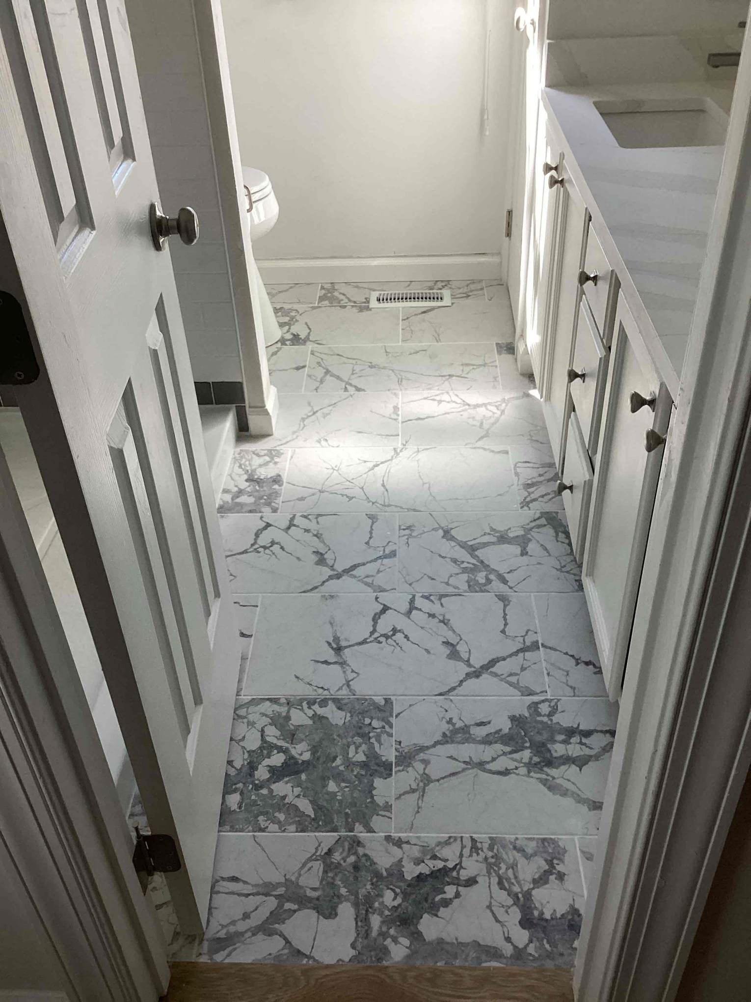 https://acehandyman-dss.ingeniuxondemand.com/Images/Offices/North Carolina/Durham Chapel Hill/42850846-ace-handyman-services-finished-marble-tile-floor-bathroom-durham-27712-nc-after.jpg New flooring and new vanity installed in a Durham NC bathroom